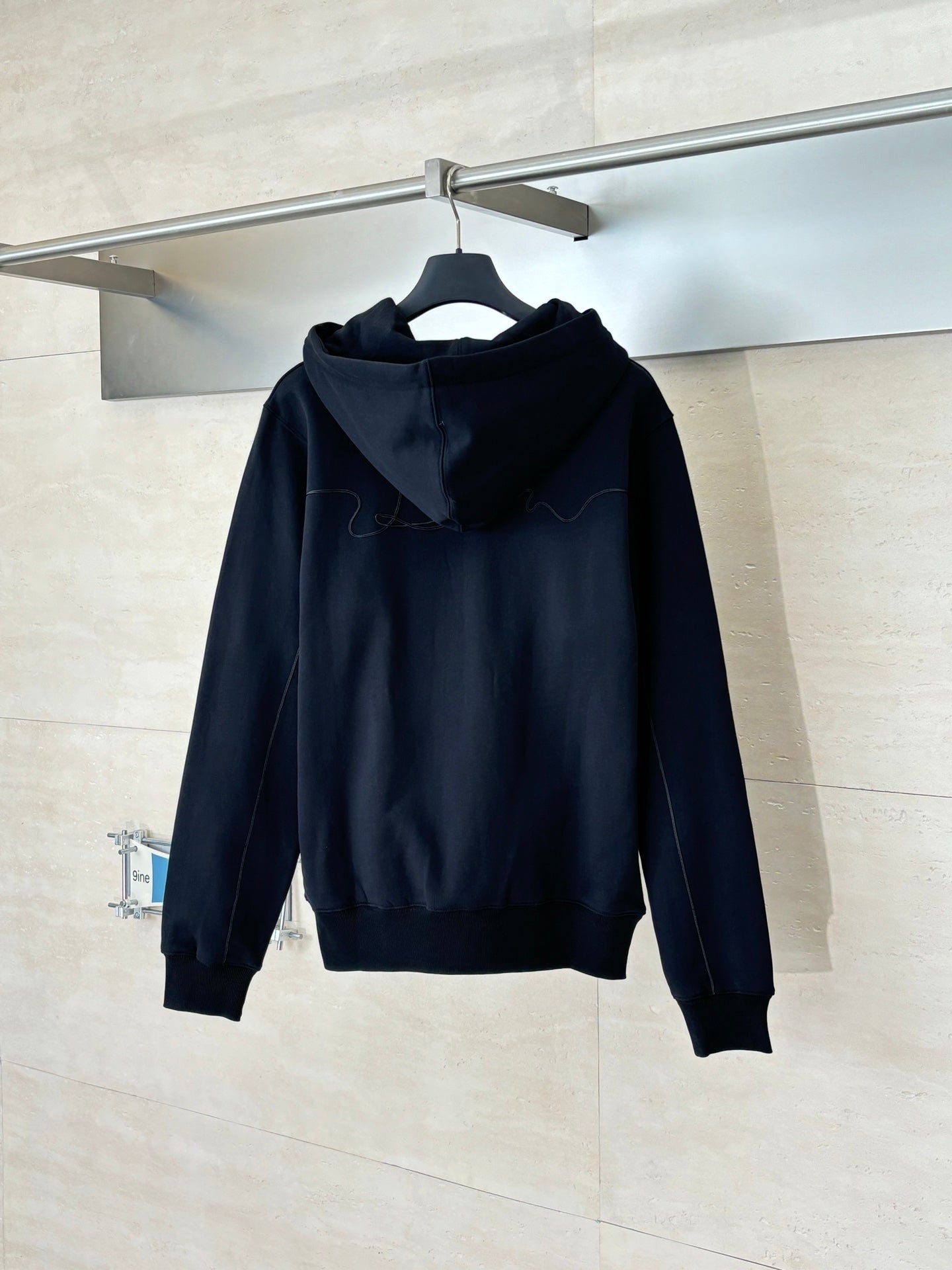 Dior long-sleeve hoodie in dark navy, back view with hood and drawstrings