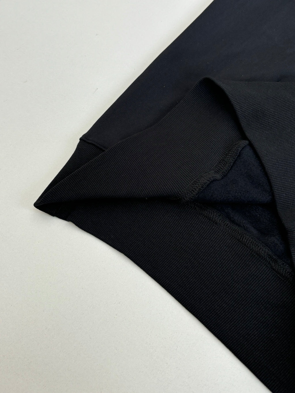 Dior hoodie cuff and hem detail in black knit