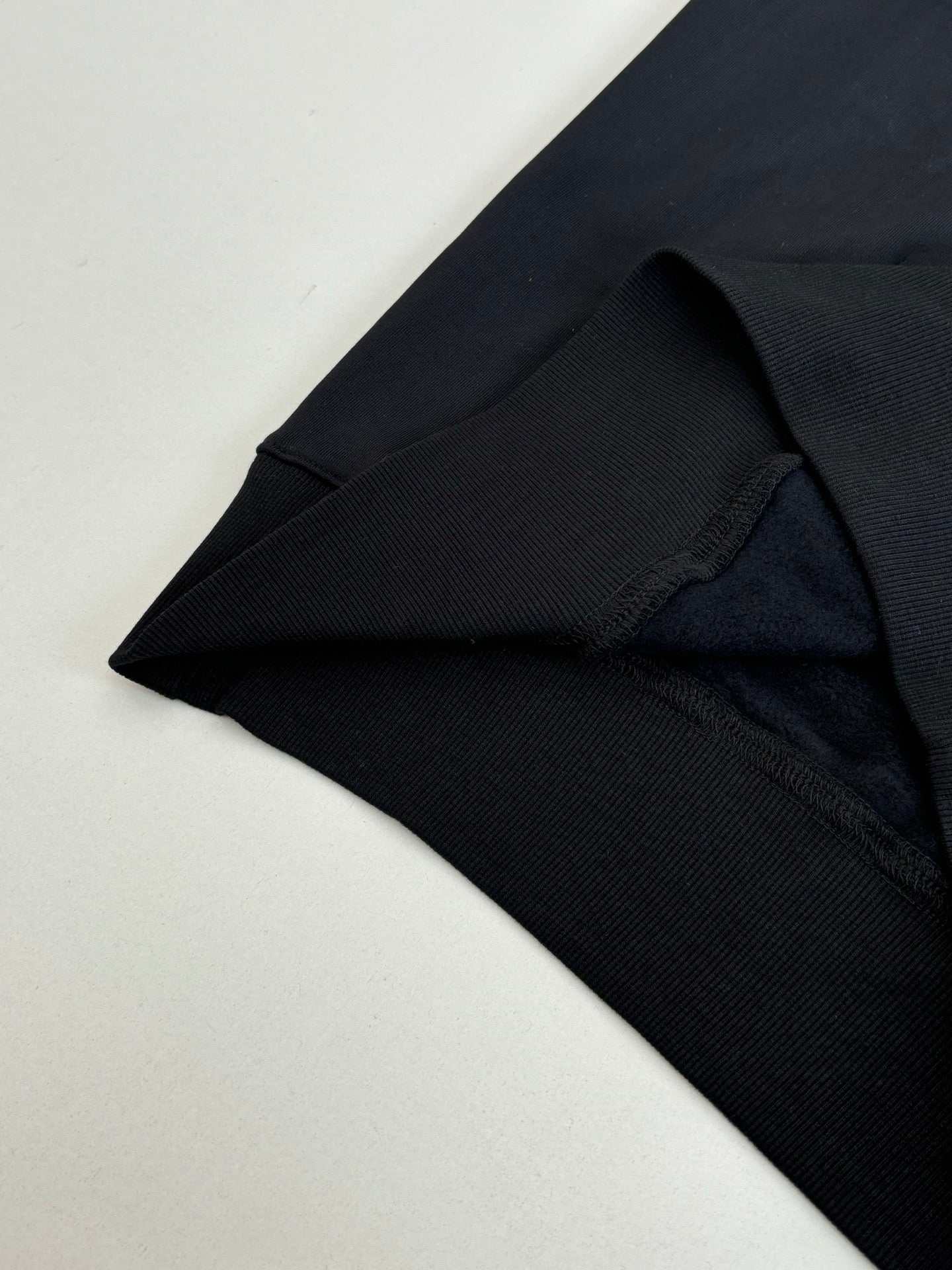 Dior hoodie cuff and hem detail in black knit