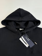 Dior hoodie in black with hood and drawstrings, embroidered Dior script on chest