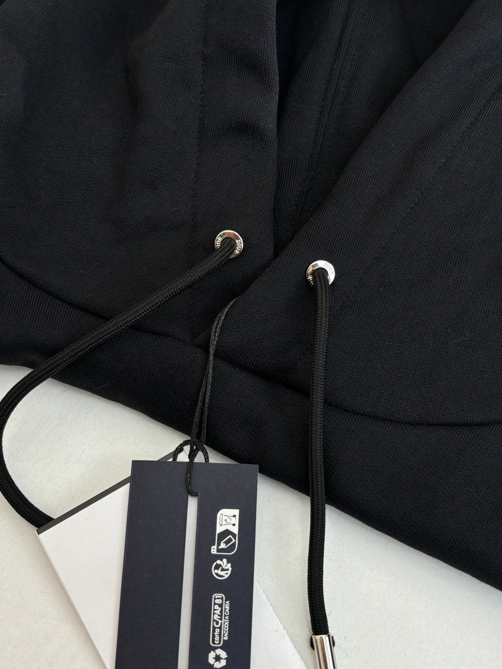 Dior hoodie hood drawstring with metal tips and product tag