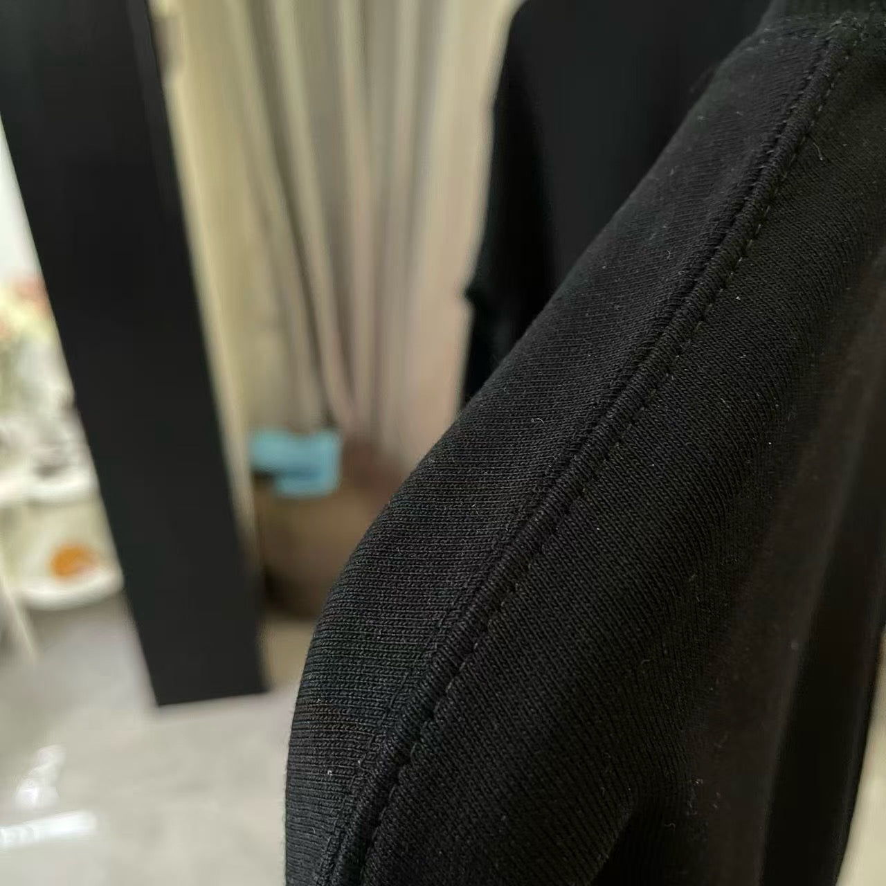 Black sweatshirt cuff with ribbed knit edge