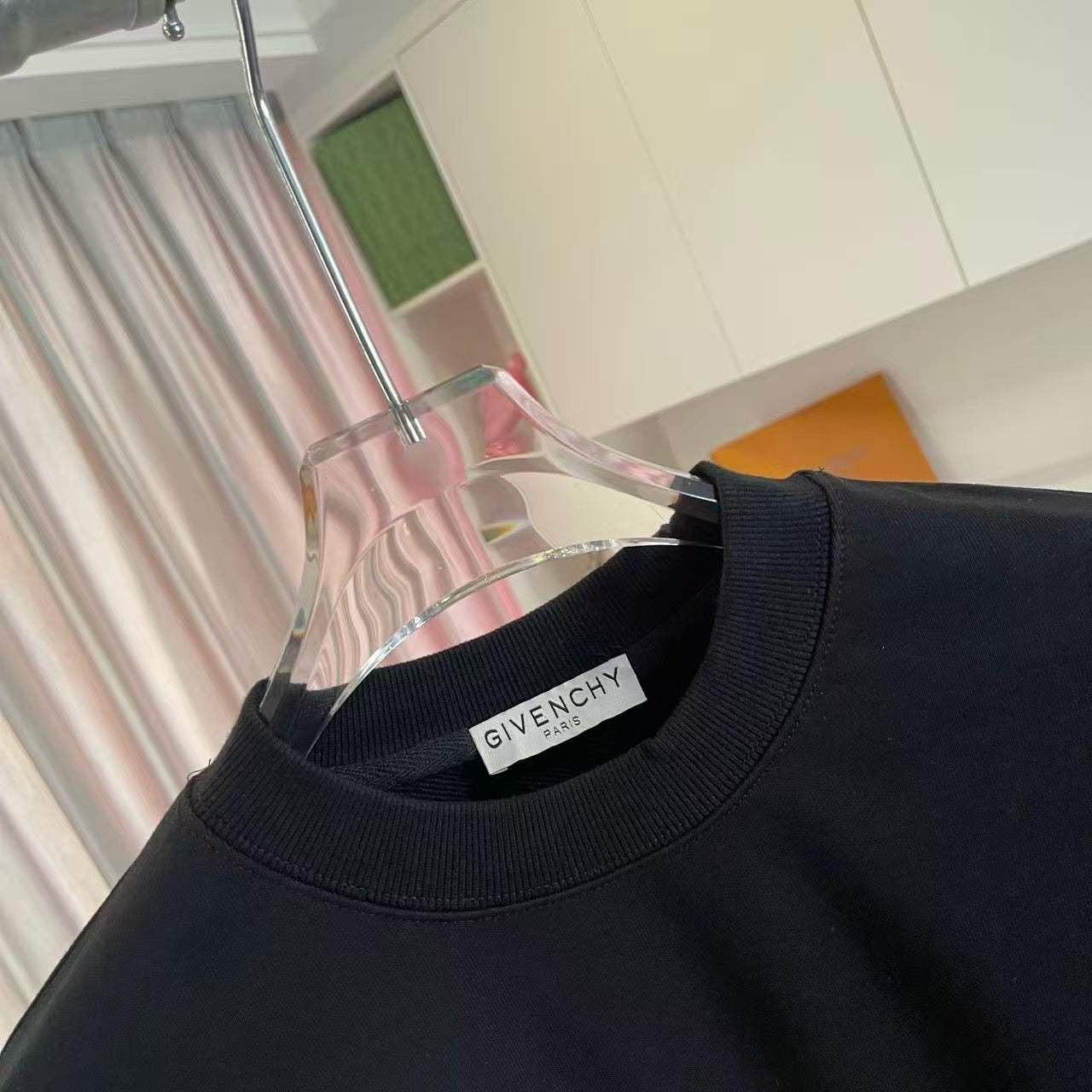 Givenchy crewneck sweatshirt neckline with ribbed collar and brand label