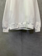 White crewneck sweatshirt hem and cuffs