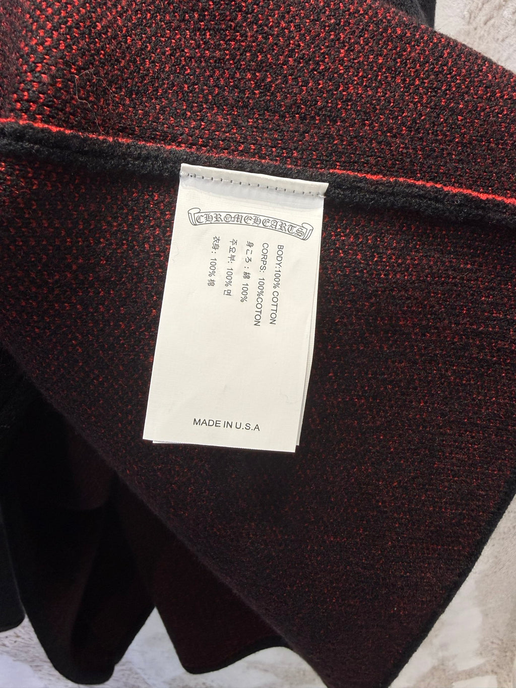 Inner label on black long-sleeve shirt reading “Made in U.S.A.”