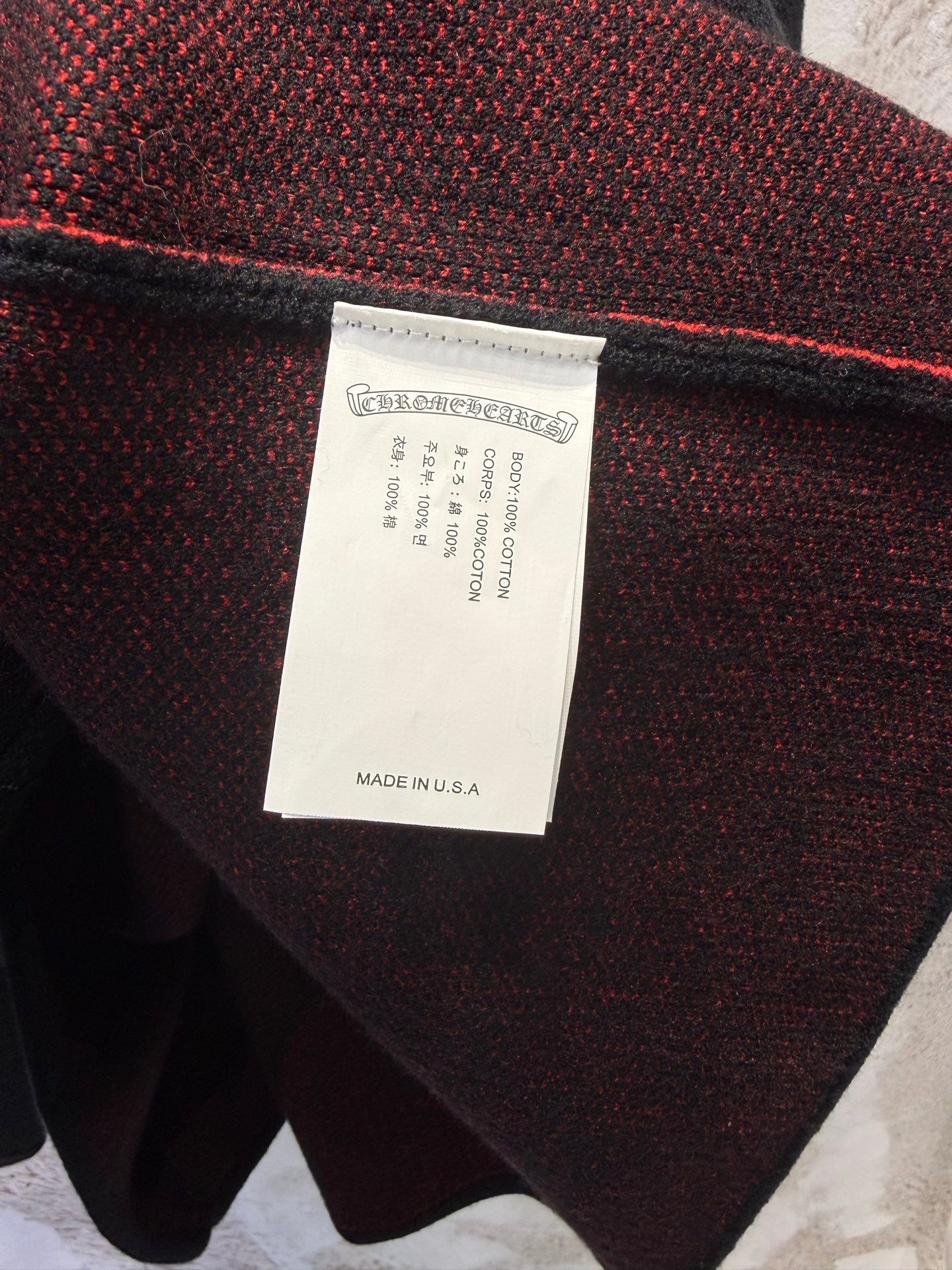 Inner label on black long-sleeve shirt reading “Made in U.S.A.”