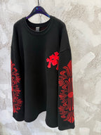 Black long-sleeve shirt with red cross applique and red patterned side panel