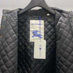 Quilted Burberry jacket with black diamond stitching and paper brand tags
