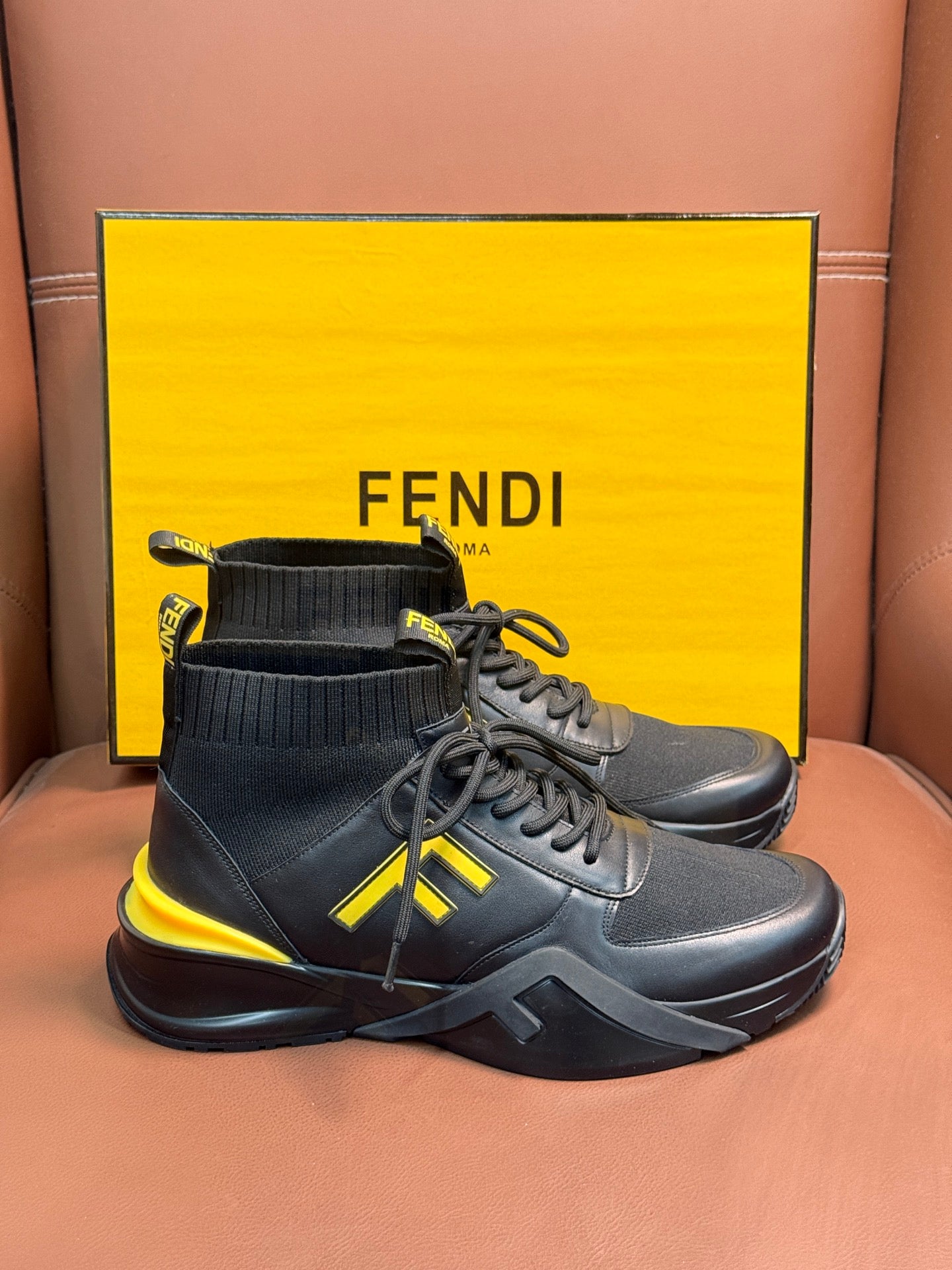 Fendi unisex ankle-high sneakers in dark gray with yellow logo and chunky white sole