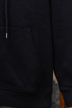 Black hoodie sleeve and side pocket with ribbed cuff