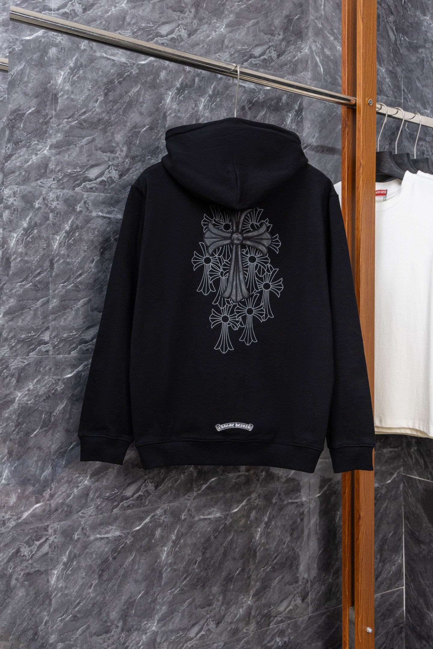 Black zip-up hoodie with large back graphic and drawstring hood
