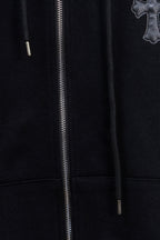 Dark zip-up hoodie front with silver zipper