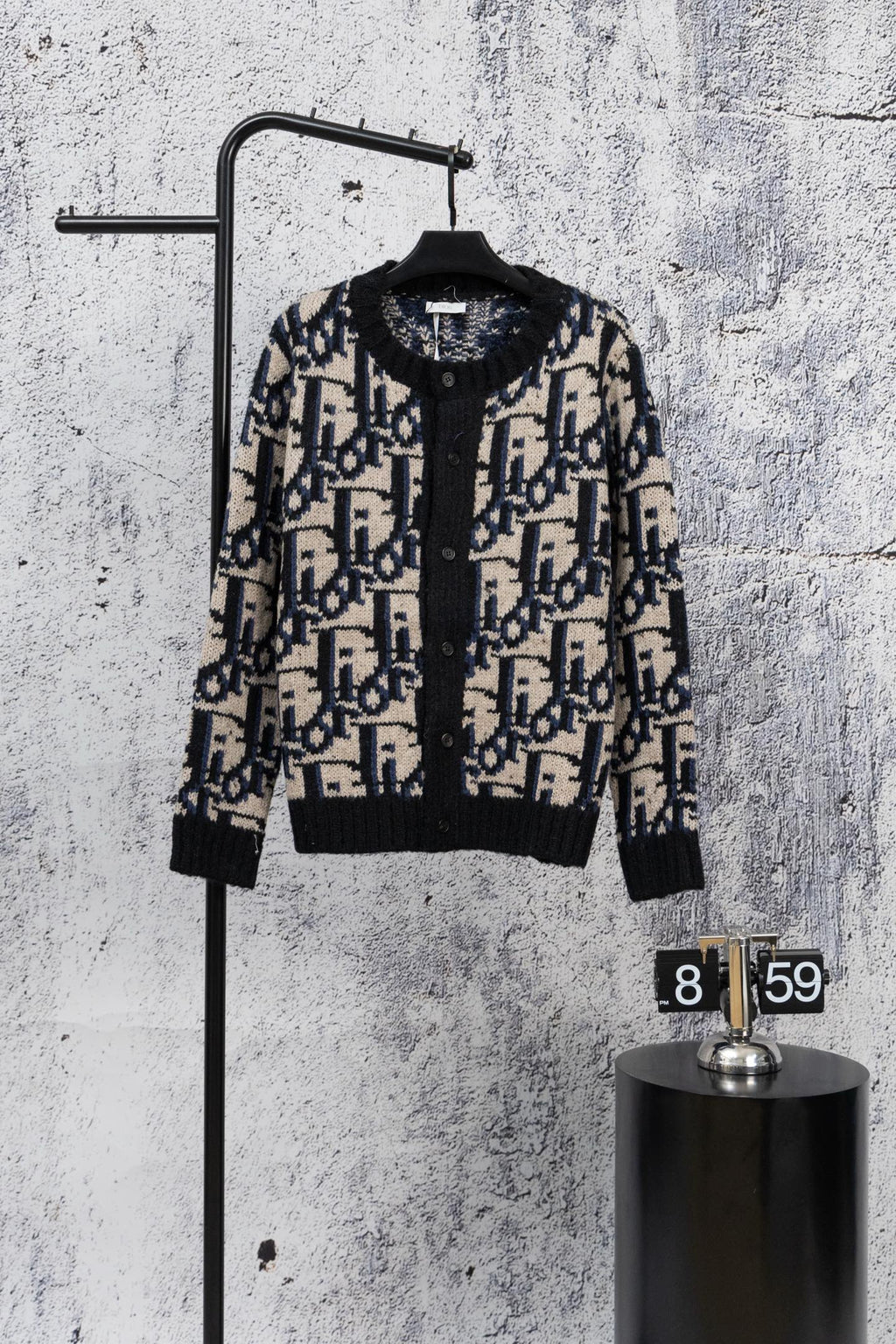 Dior knit cardigan with black base, navy and cream geometric jacquard, button front