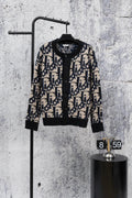 Dior knit cardigan with black base, navy and cream geometric jacquard, button front