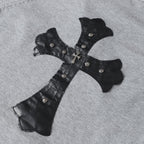 Gray hoodie with black corset-style applique, silver buttons, and bow tie