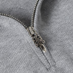 Light gray hoodie zipper with metal pull and contrast zipper tape