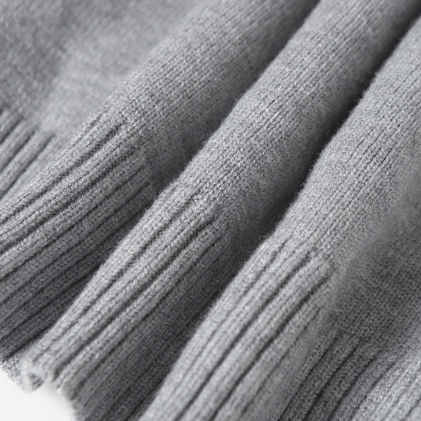 Heather gray knit hoodie fabric with ribbed sleeve cuffs