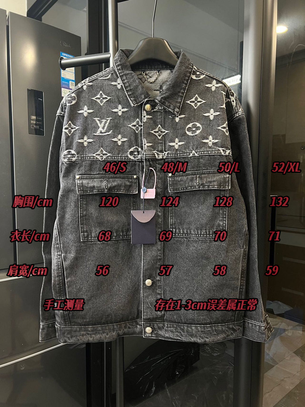 Monogram denim jacket front with size labels and hanging tags, dark gray with cream Louis Vuitton icons