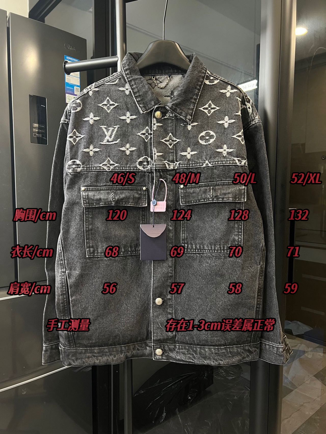 Monogram denim jacket front with size labels and hanging tags, dark gray with cream Louis Vuitton icons