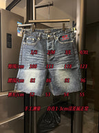 Balenciaga denim shorts on rack with red logo heart and sizing measurement overlay