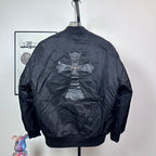 Dark blue bomber jacket back view with large cross emblem and ribbed hem