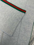 Gray Gucci pants with front pleat and red/green side stripe detail