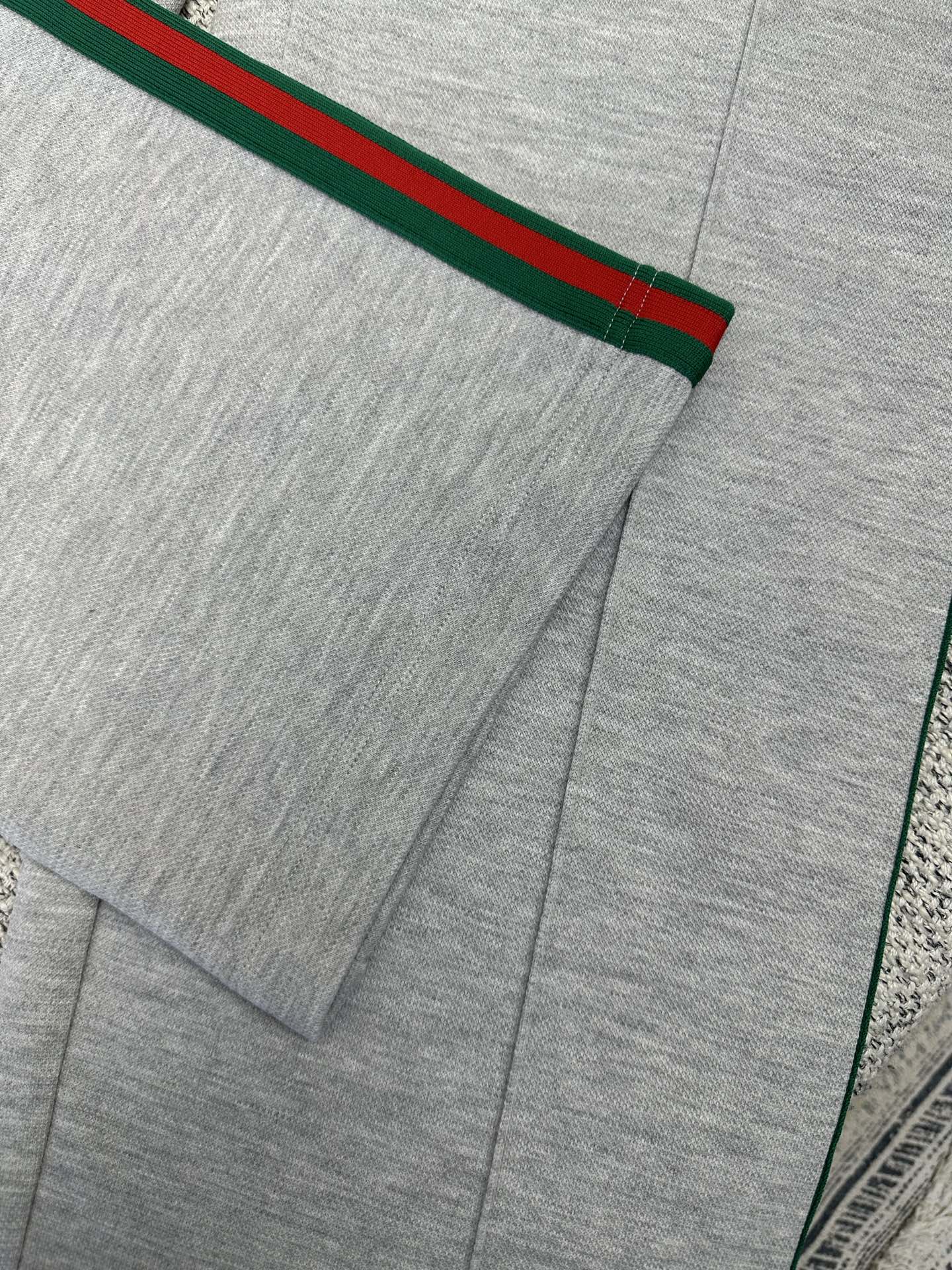 Gray Gucci pants with front pleat and red/green side stripe detail