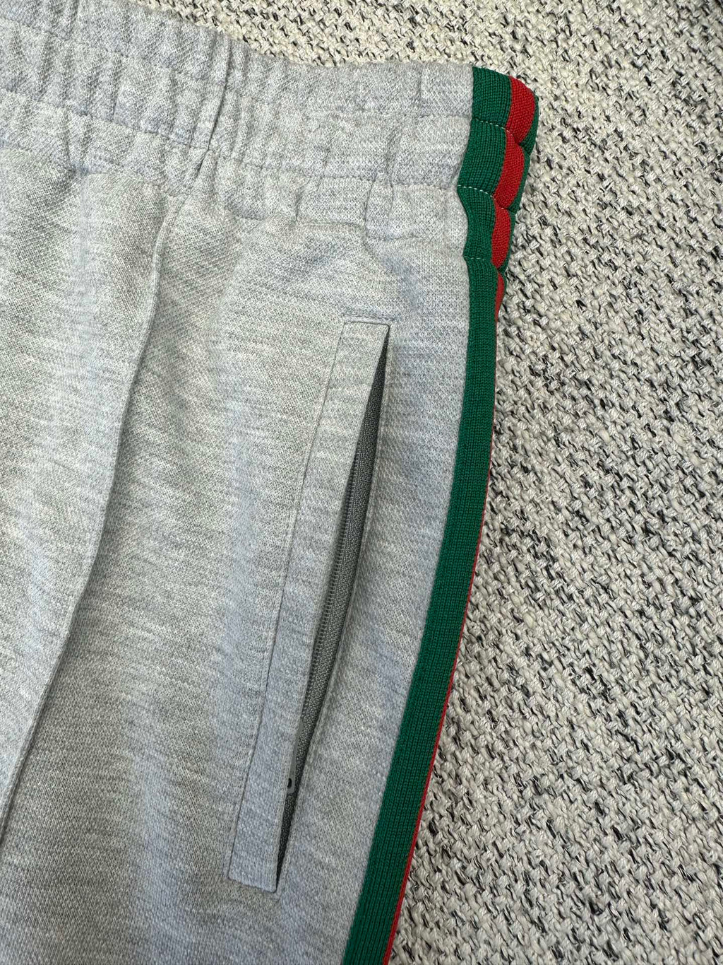 Gray Gucci pants with front slit pocket and red/green side stripe