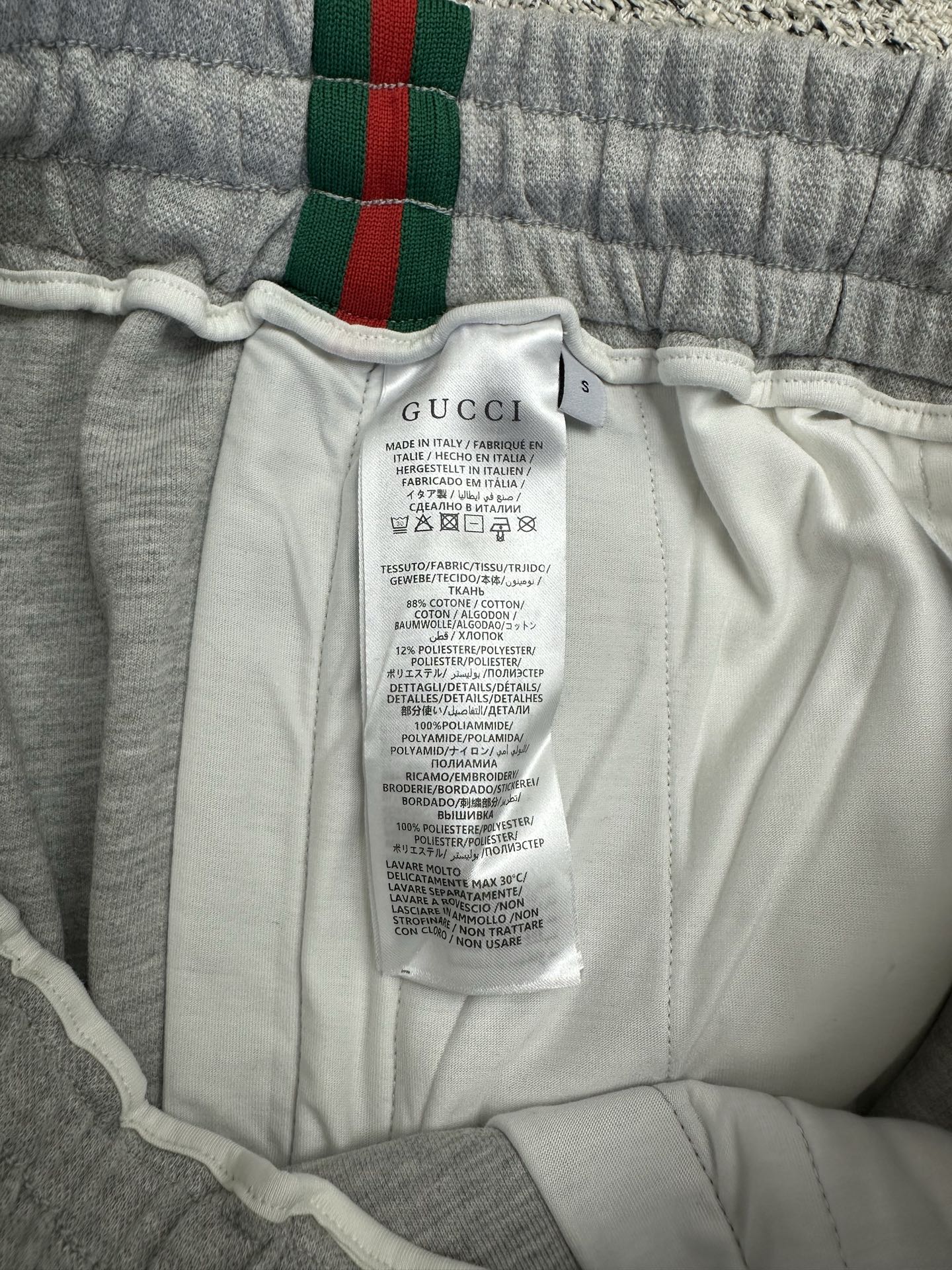 Gray Gucci pants with inner care label and elastic waistband