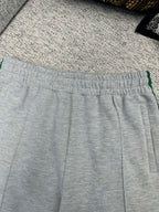 Gray Gucci track pants waistband with green stripe side trim