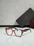Prada eyeglass frames with maroon acetate and clear lenses, metal detail on temples.