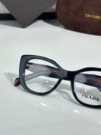 Prada eyeglasses close-up, dark blue oversized rectangular frames with clear lenses