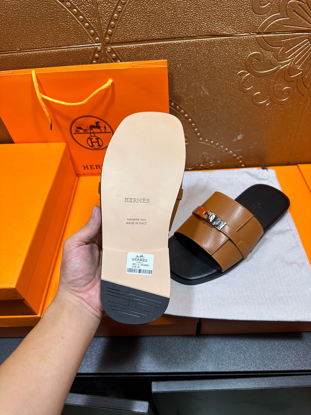 Sandals sole underside with brand text and size label on white insole