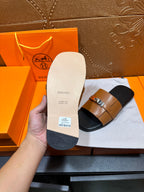 Sandals sole underside with brand text and size label on white insole