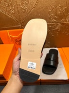 Hermes slide sandal outsole and footbed in beige with Hermes stamp