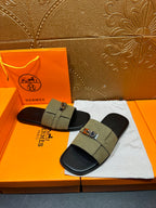 Hermes luxury sandals with olive green slide straps and silver buckle, black footbeds
