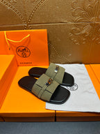 Hermes luxury sandals with olive green upper band and silver buckle, black slide sole