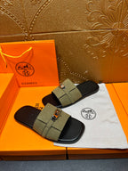 Hermes slide sandals, olive green straps with silver buckle detail over black sole