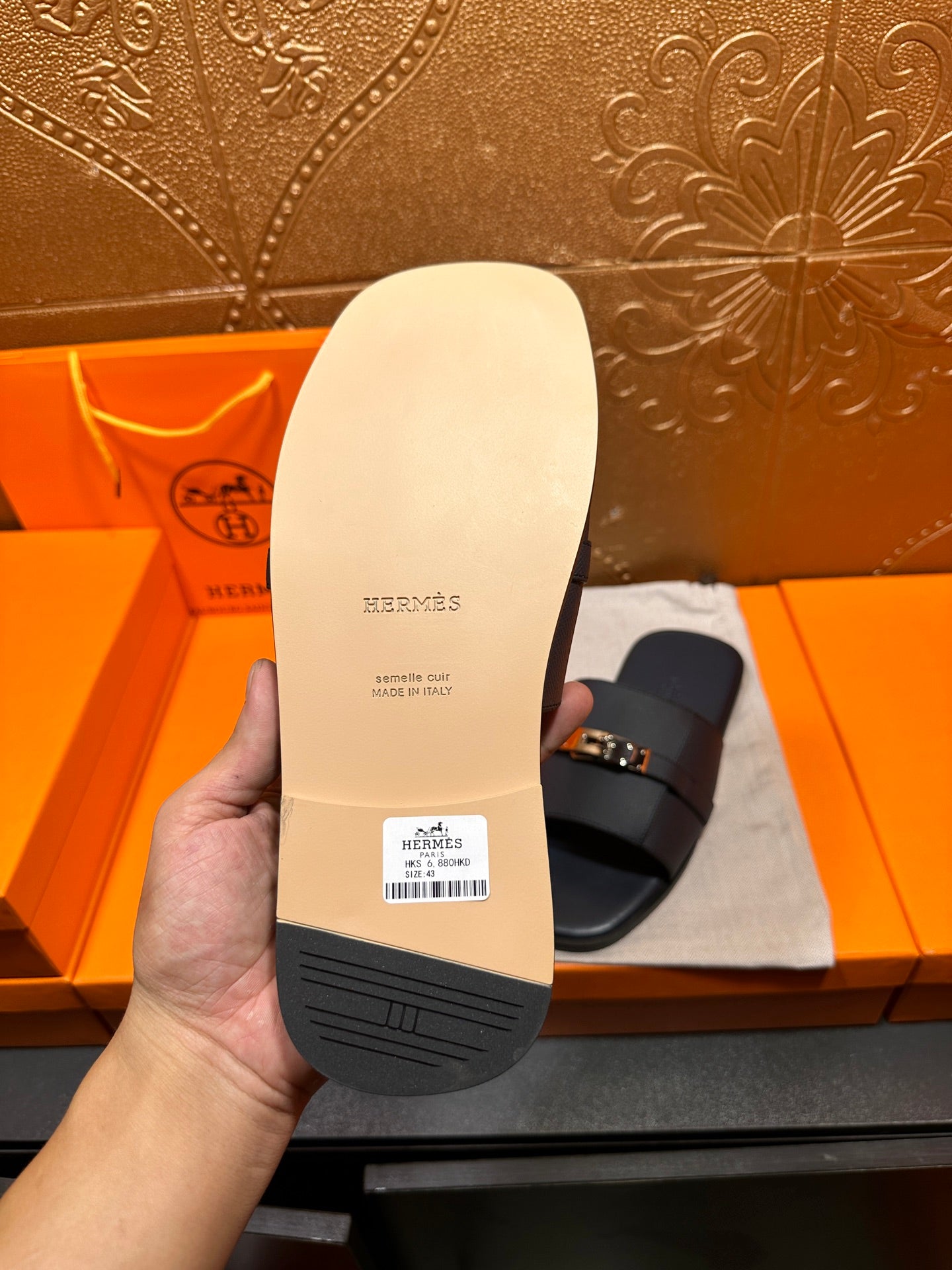 White sandal outsole with 'Hermes' printed and textured tread