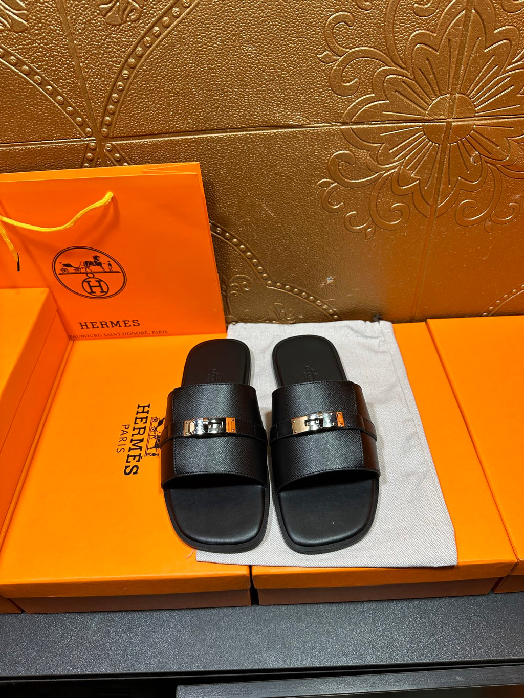 Hermes black leather slide sandals with square metal buckle, two wide straps