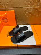 Hermes black leather slide sandals, single buckle strap across the top