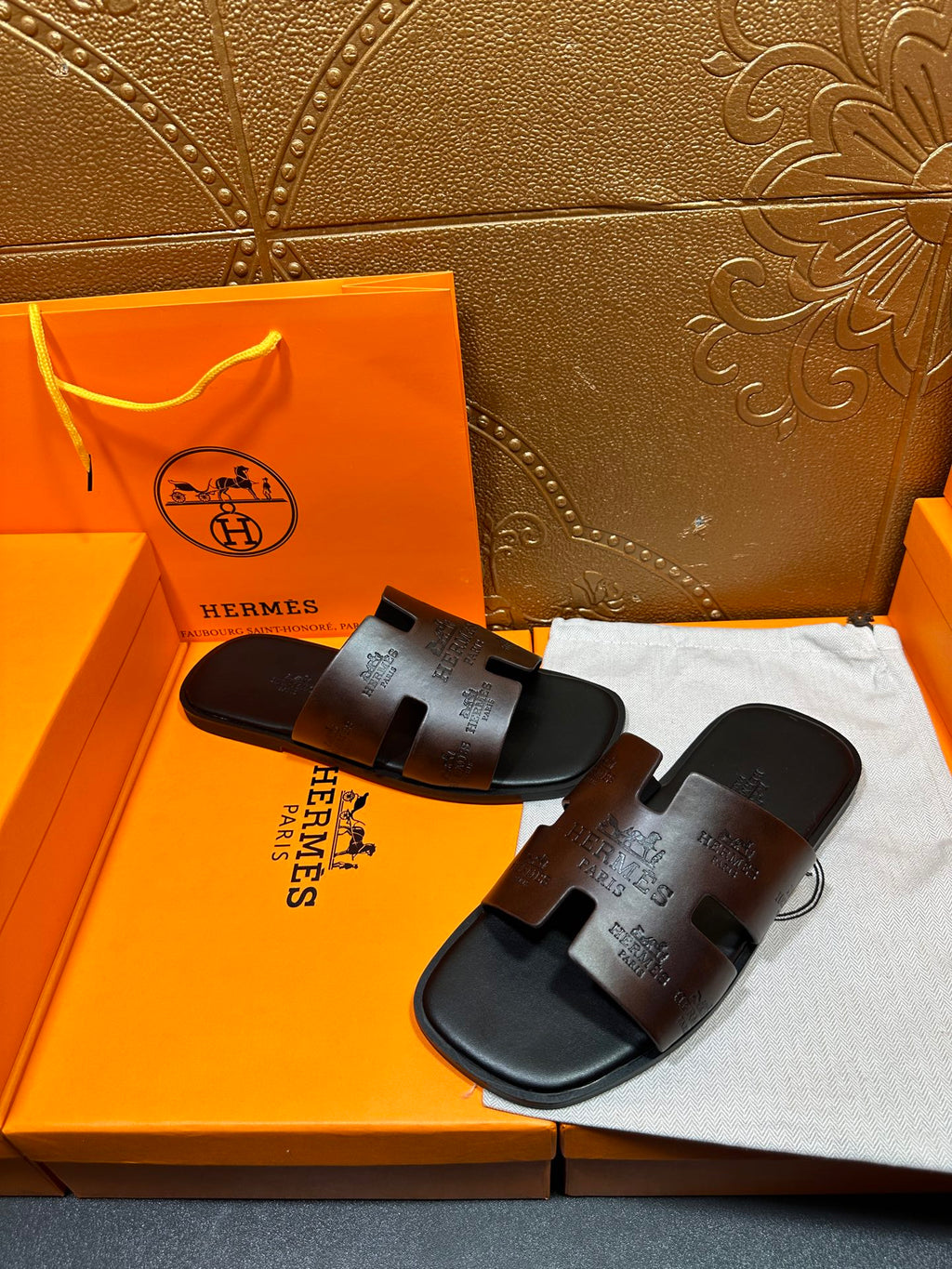 Hermes sandals, black slide sandals with embossed H logo on the footbed