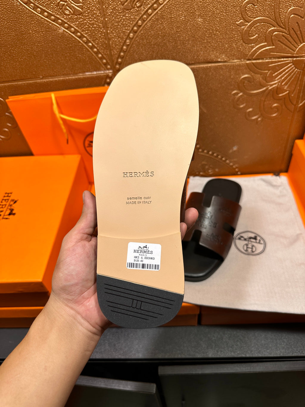 Hermes sandals sole view; light beige outsole with embossed brand and label