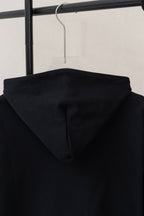 Dior black hoodie back view with centered hood and raised seam details
