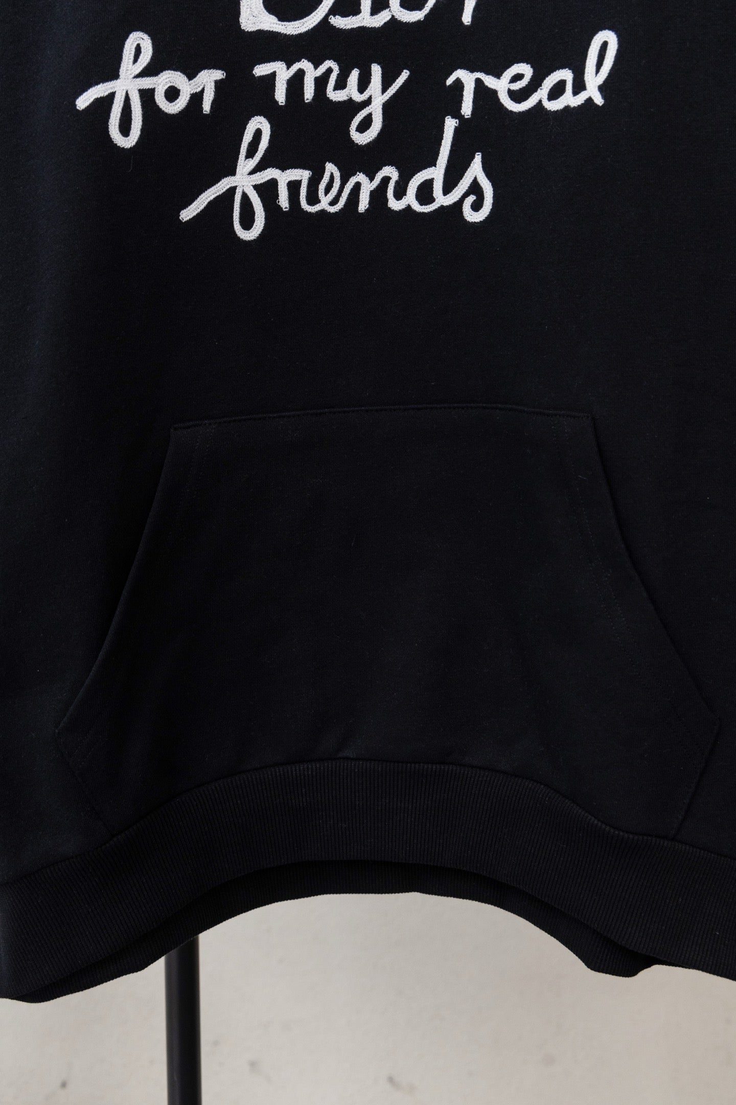 Dior black hoodie front pocket with 'Dior for my real friends' text above