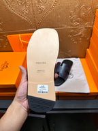 Hermes slide sandal outsole, white bottom with embossed Hermes text and barcode