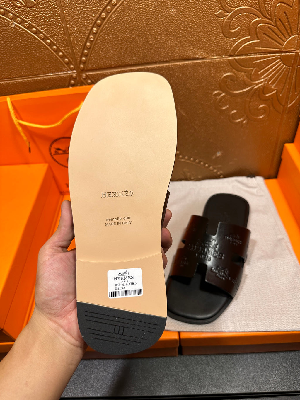 Hermes sandal outsole underside, light sole with brand text