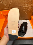 Hermes sandal outsole underside, light sole with brand text