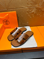 Hermes leather sandals, dark brown slide sandals with wide strap across foot