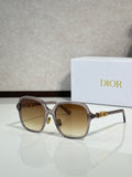 Dior sunglasses with dark tortoiseshell frame and amber-tinted lenses, gold accents